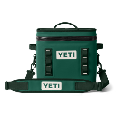 Green YETI cooler bag with straps on a white background