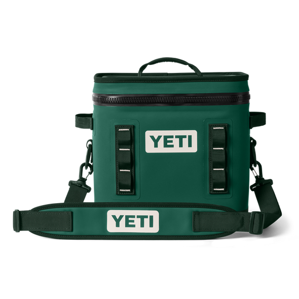 Green YETI cooler bag with straps on a white background