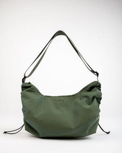 Nylon Handbag With Custom Logo Webbing And Cinching At Sides. 55% Nylon 45% Polyester
Zip Closure