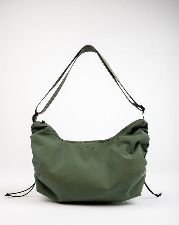 Nylon Handbag With Custom Logo Webbing And Cinching At Sides. 55% Nylon 45% Polyester
Zip Closure